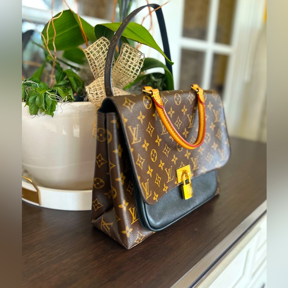 Louis Vuitton
Marignan Handbag Monogram Canvas with Leather $1600 - Picture 4 of 16